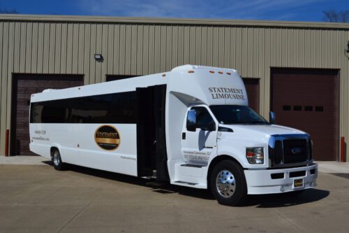 Vehicle Color: White  Amenities:  LED Lighting Upgraded Audio with Bluetooth Built-in Cooler with Cup Holders Video Monitor with CD/DVD playback Rear Climate Control Rear Audio Control  Long Description:  Ford F750 limo bus. Seats up to 50 passengers. Ideal for 40 adults. Comes equipped with wrap around leather seating, hardwood flooring, 1 bar area with built in cooler, colorful LED lighting, 4 large flat screen TVs, and updated audio system with Bluetooth connectivity.